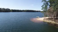 Family  friendly lakefront property on large wilderness estate with sandy beach