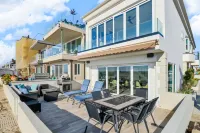 Located directly on the Sand. Two Master Suites, four bedrooms, four bathrooms.