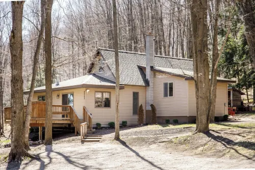 Centrally located cozy cottage tucked into the woods, a perfect family retreat