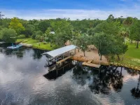 3-bedroom Riverfront home with private boat dock and view of Steinhatchee River.