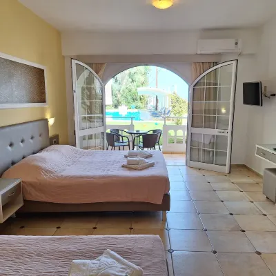 Perla Beach Hotels near Stalos Beach