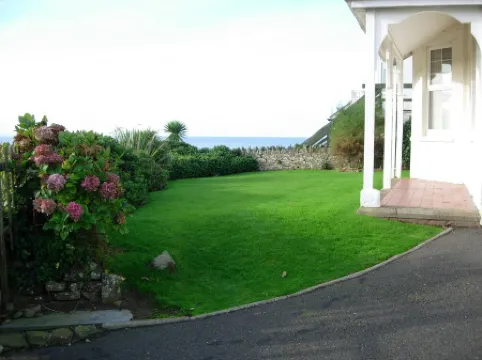 Pendragon House Overlooks Crooklets Beach in Bude with parking for 5 cars.