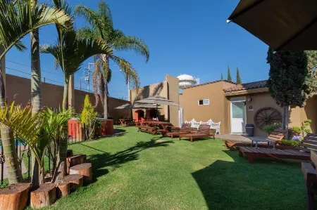 Capital O la Huerta Golf & Hotel Отели в г. Чолула де Ривадабия