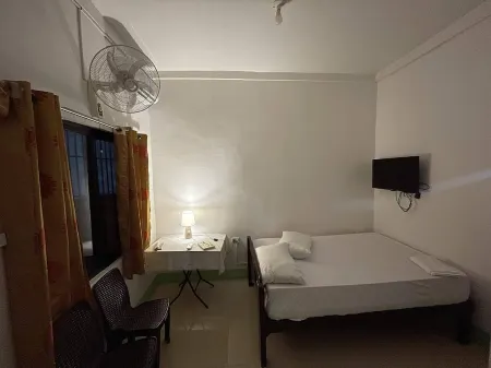 Cozy 1-bedroom apartment with WiFi, AC in tranquil Dauin