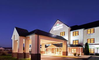 "a modern hotel building at night , with its name "" comfort inn "" prominently displayed above the entrance" at Country Inn & Suites by Radisson, Salisbury, MD