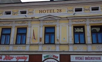 "a building with a sign that reads "" hotel 2 8 "" prominently displayed on the side of the building" at Hotel 28
