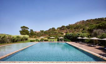 Baia Chia Laguna Resort, Curio Collection by Hilton