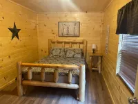 3BR, 2 Bath Cabin with full kitchen, living room, and hot tub.