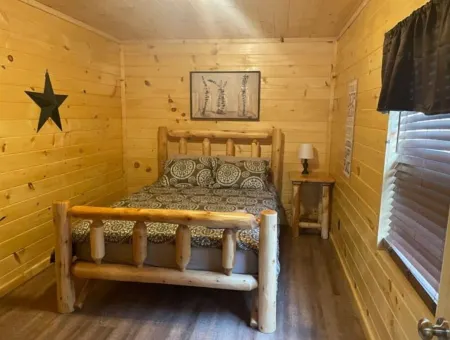 3BR, 2 Bath Cabin with full kitchen, living room, and hot tub.
