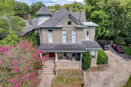 Victorian home with four bedrooms and four and one half bathrooms.