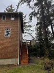 private hot tub, fun game room, cozy beach house