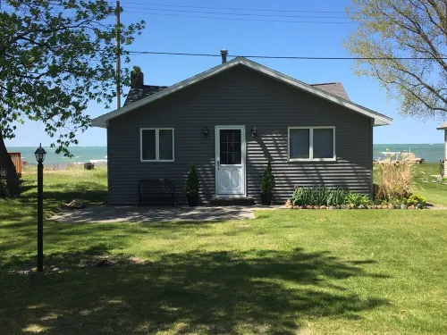 Charming and Cozy Lake Front Cottage on Private Beach Hotels in Hume Township