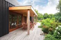 Modern wooden house on the Bodden with two apartments that can be combined