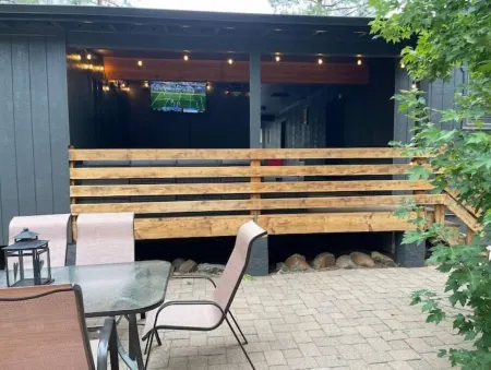 Caribou Cabin Outdoor Deck w Firepit Table & TV