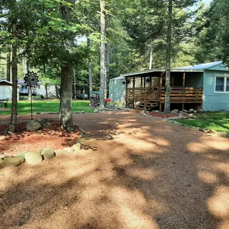 Cozy nestled in quiet neighborhood. On snowmobile and ATV trail.