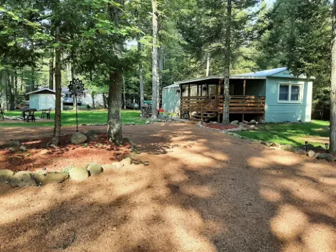 Cozy nestled in quiet neighborhood. On snowmobile and ATV trail.