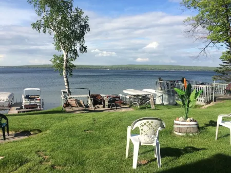 Vacation Stay at Hubbard Lake Air-Conditioned Lakefront Mobile Home