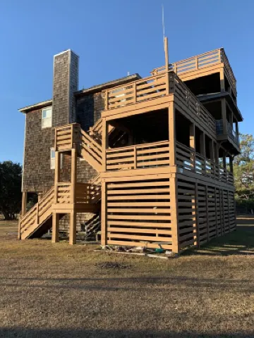 4X4 only! Canal front. Ocean AND sound views! Decks and porches on all levels.