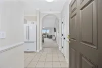 Modern Golf-View Condo • Barefoot Resort • Pools • Beach Gear Included