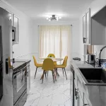 4BR Near Airport - King Bed, Beauty Bar, & Parking