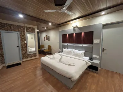 Aamod Feather Touch Hotels near SHREE KAINCHI HANUMAN MANDIR