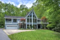 Stone Fireplace and Scenic Outdoor Spaces - Charming Mountain Chalet