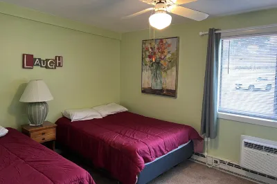 Water view condo with a pool, tennis court, fireplace, balcony & golf nearby