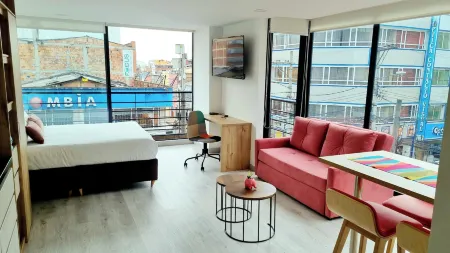 Toscana Loft - Apartasuites Отели рядом с достопримечательностью «Biblioteca Pública Virgilio Barco»