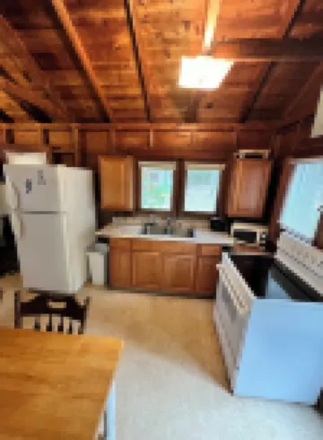 Rustic View Cabin sits on a 2.5 acres on beautiful Hubbard Lake.