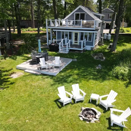 Relax in Raymond's lakefront 2-bedroom vacation home, just steps to Sebago Lake