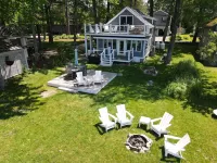 Relax in Raymond's lakefront 2-bedroom vacation home, just steps to Sebago Lake