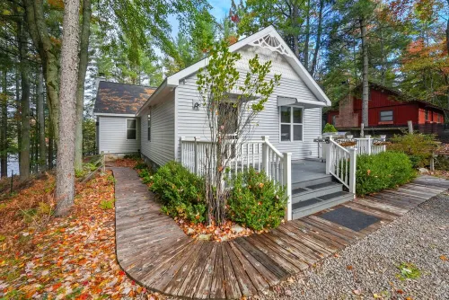 Lakefront retreat 30 min to Traverse City. Hot tub, fire pit, kayaks, game room.