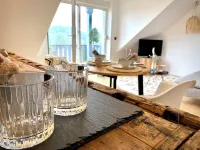 BioLoft by the lake and distant views.  Cozy vacation apartment on the top floor