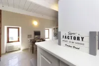 LOVELY APARTMENT IN AN ANCIENT HAMLET WITH LAKE VIEW AND PATIO Hotels in Marone