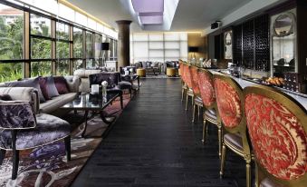 elegant dining experience, featuring ample natural light and a tasteful arrangement of furniture at Sofitel Saigon Plaza