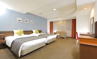 a hotel room with two beds , a desk , and a window , all decorated in white and beige colors at HOTEL MYSTAYS Utsunomiya