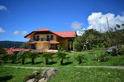 Guayabo Lodge Hotels near Ceiba Hospital