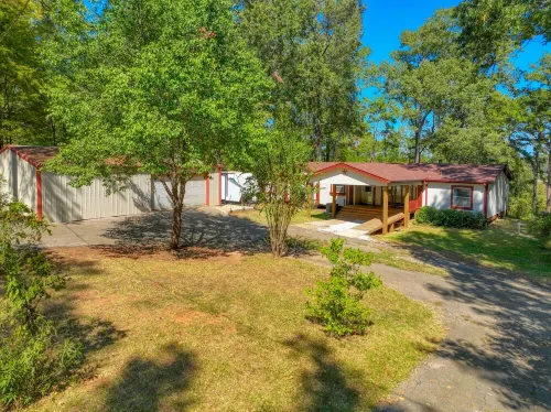 Waterfront home on a beautiful wooded, private1 acre lot on Sam Rayburn.