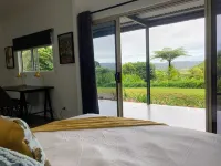 NEW -The Sugar Shack, Ocean views over cane fields from your outdoor Spa Bath