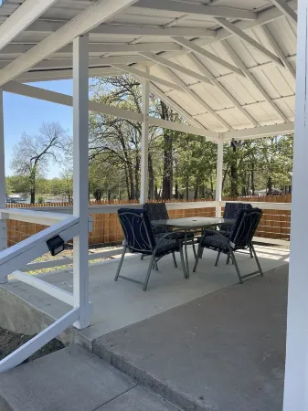 Studio cabin #2 with lake view, boat dock access, outdoor seating, and firepit.