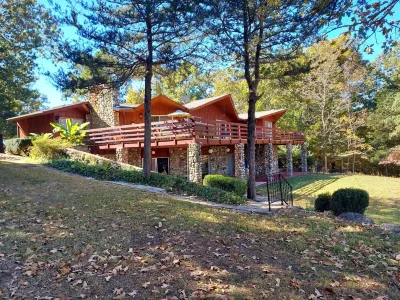 Rock Inn Retreat: E Faye Jones Style Home.  Rock Walls in All Bathrooms!