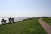 near the dyke (30m) and green beach, sea water swimming pool