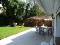 Spacious apartment in villa with large private garden and terrace near the sea