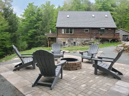 Secluded modern log cabin with picturesque private water fall on 12 acres!