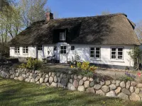 Relax under thatched roof between the seas