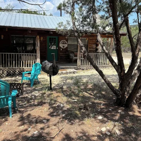 Cozy Log Cabin called Buffalo Horizon. Sleeps 4.  Close to Frio River