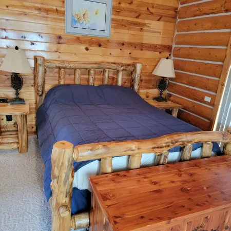 Large garage for bikes. Beautiful log home.  On golf course.