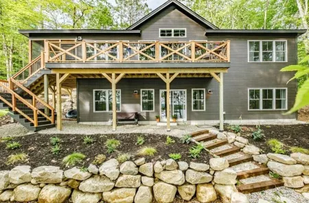 Beautiful new modern cabin with 100 feet of shoreline on Long Lake