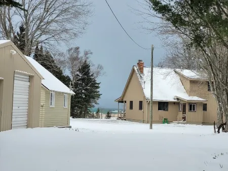 Waterfront house w/ large garage located on trail 8 in Grand Marais.