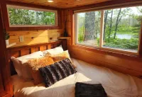 Near Pictured Rocks and trails, on the AuTrain River, has private hot tub